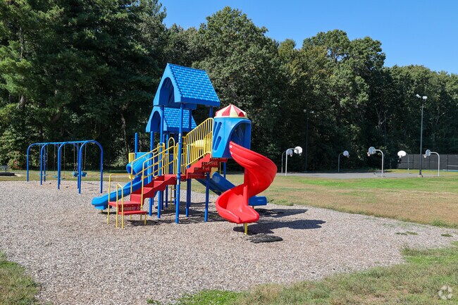 Watrous Park offers a playground, swings, and massive basketball court for recreation.