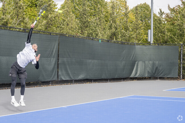 Face off against friends in a tennis match on the asphalt courts at McGraw Park in Hedgewood.