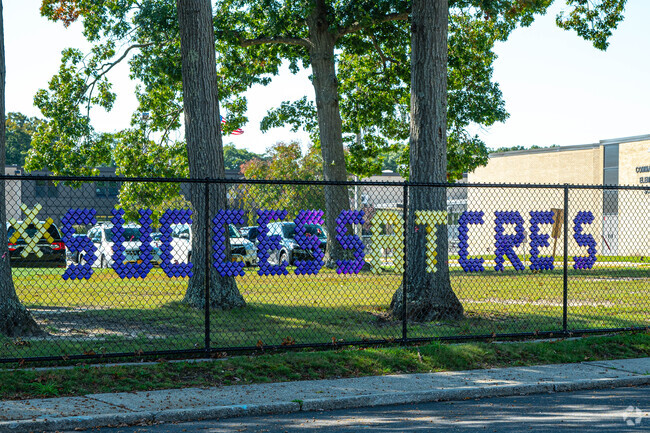 School pride art work shows on the front fence.