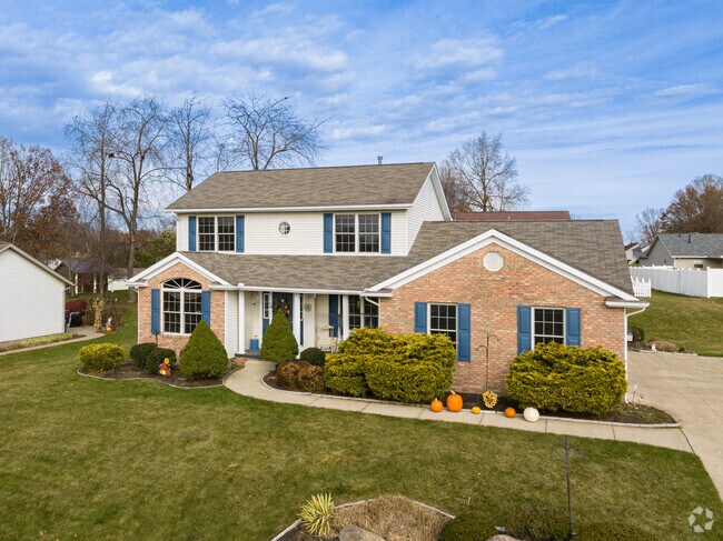 A two story home is a mix of brick and wood in East Brookfield.