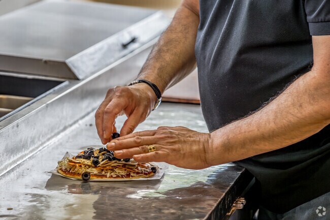 Locally owned and operated Straw Hat Pizza serves up hot pizza pies in Cordova Gardens.