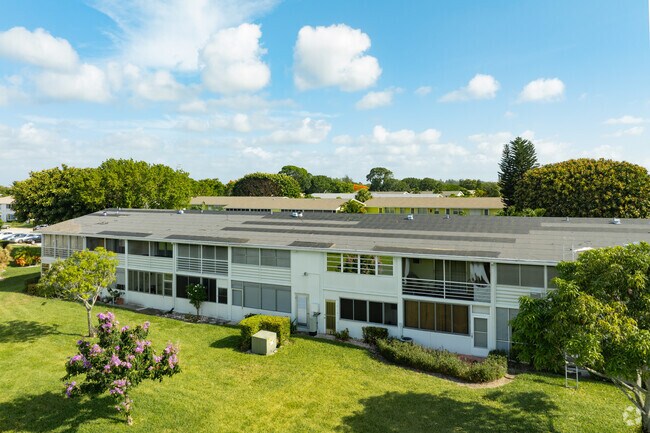 Residents of Century Village enjoy tranquil, manicured lawns and beautiful surroundings.