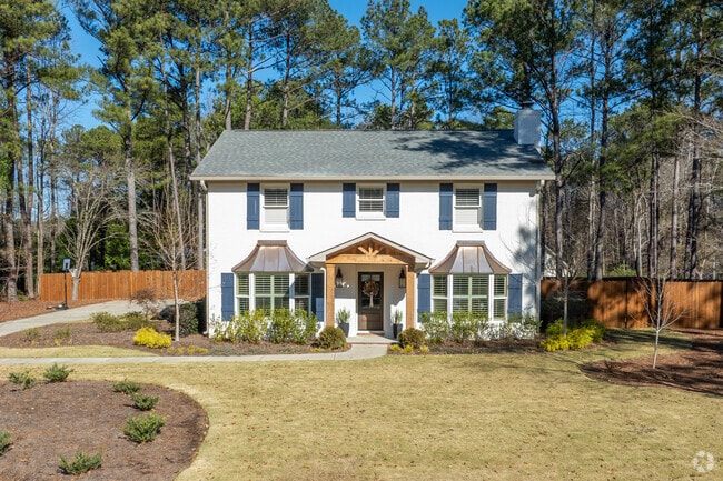 A newly renovated front porch adds even more beauty to this home in Wrights Mill Estates.