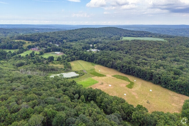 Farms scattered across Lebanon are carved from the forested plain of eastern Connecticut.