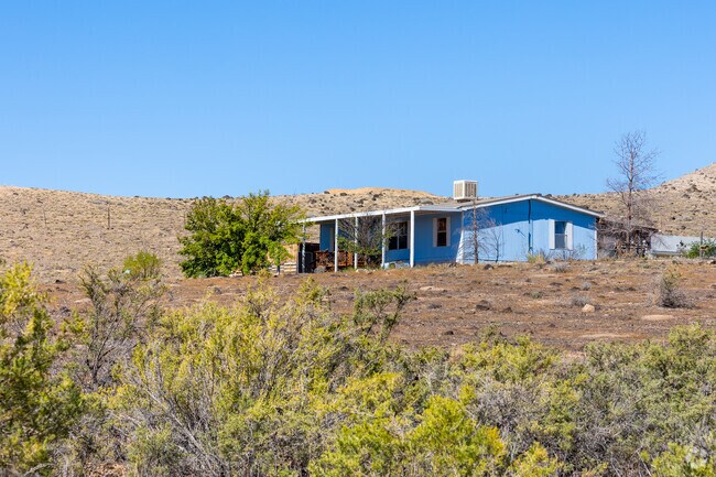 Some ranch-style homes in Orchard City offer shaded porches.