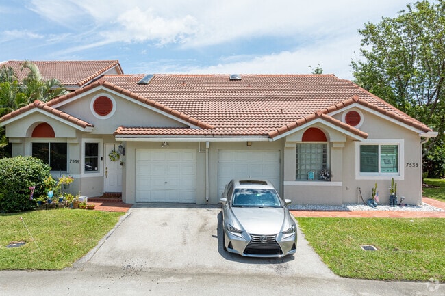 In Holiday Springs, you will find Spanish-style townhouses that include garages.
