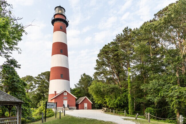 Assateague Lighthouse, just 10 miles from Atlantic, VA, is a red-and-white beacon standing 142 feet tall. Built in 1867, it still guides ships today and offers panoramic views of Chincoteague and the wildlife refuge—a favorite day trip for Atlantic locals and visitors alike.