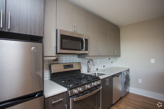 5 Burner Gas Range, Oversized Microwave, Subway Tiled Backsplash