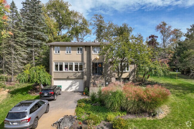 A mid-century modern home in West O'Hara Township has an attached garage.