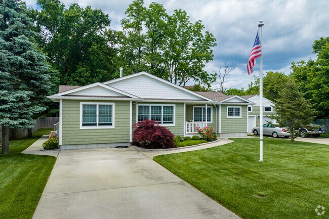 Many homes in Lake Grove offer large front and backyards.