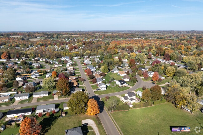 Mayflower Village has various home types that sit among the trees.