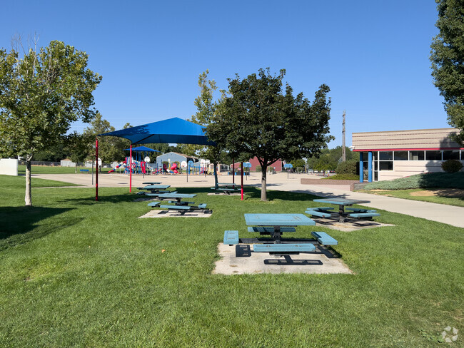 There is outdoor seating at Riverside Elementary School.