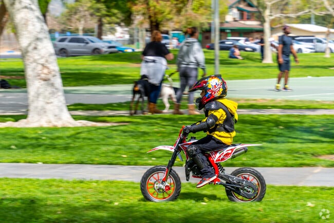 Kids enjoy thrilling mini-motorcycle rides through open tracks at Regional Park in De Anza, San Jacinto.