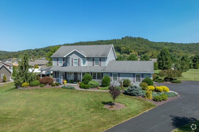 Contemporary homes in Wolf Township have large front porches, yards, and attached garages.