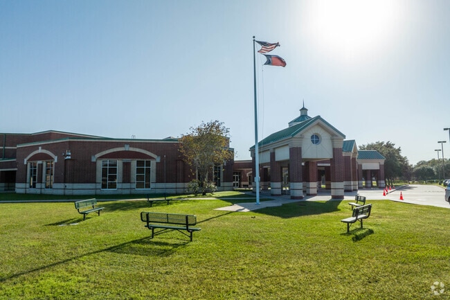 A set of bench seats located outside of Rogers Middle School.