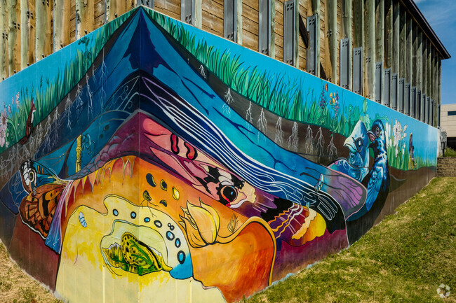 There is an ecology-themed mural outside of the Middleton Operations Center in Northside.