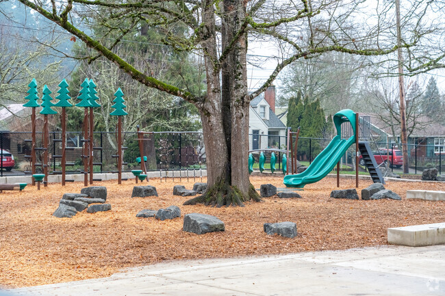 Edison Elementary School has a sitting area under a tree on the playground in Eugene.