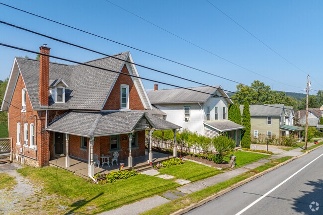 Colonial style homes have covered front porches in Milesburg in Boggs Township.
