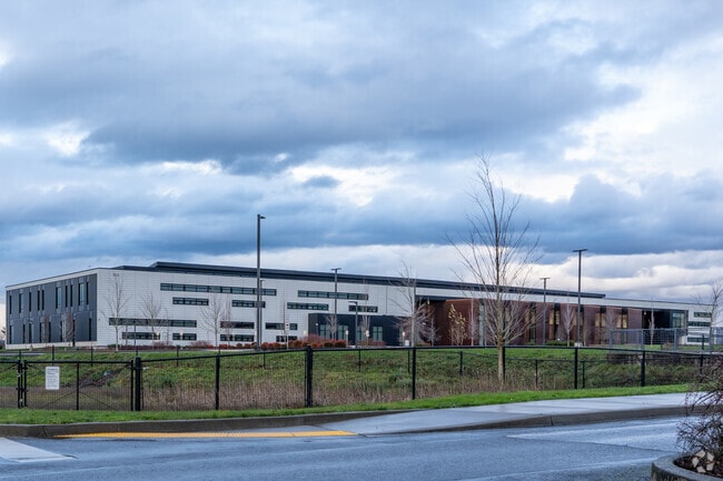 Wide angle street view of Discovery High School.