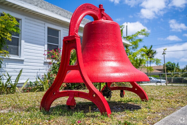 A church bell hangs above the streets of Whispering Palms.