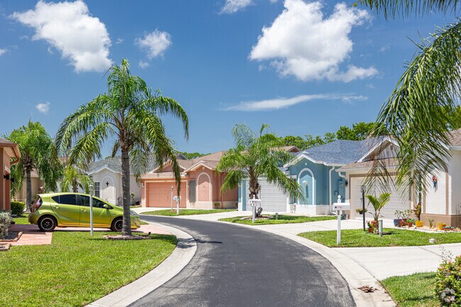 Homes in Corkscrew Woodlands are colorful and built in rows around a circular design in the City of Estero.