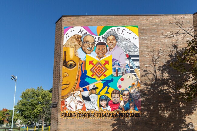 A colorful mural tells the story of Borchert Field and unity.