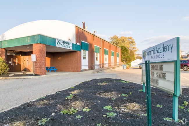 Summit Academy has a monument sign with message board near the parkway.