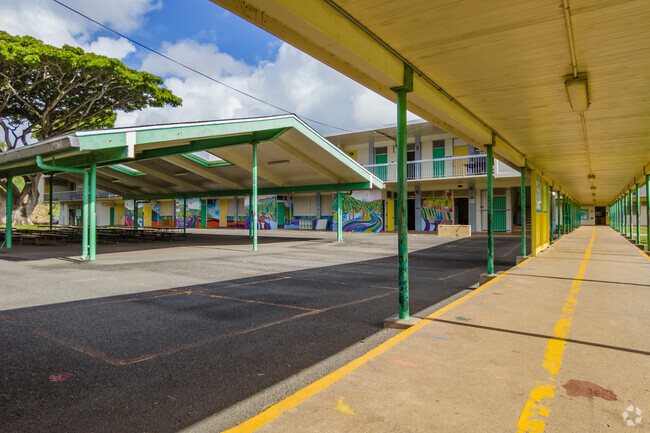 Embrace the beauty of Puohala Elementary's vibrant campus, where lush greenery and inspiring student art await.