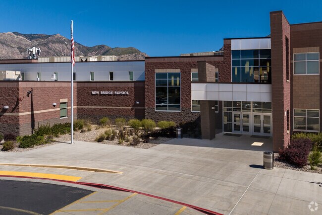 New Bridge School has a modern look and sits at the base of the mountains.