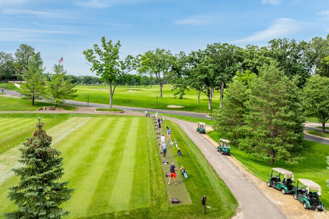 Golfers practice their game at the Interlachen Park Country Club