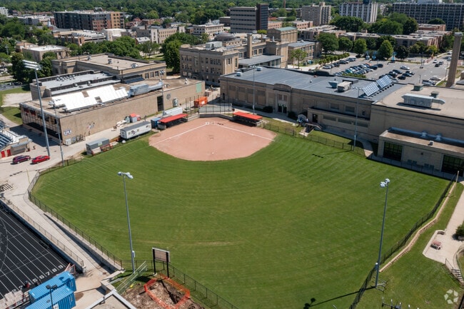 Shorewood High School baseball players can be seen practicing on the baseball field.