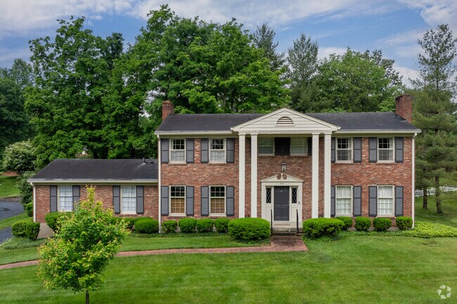 This is a brick faced colonial revival home in the Riverwood neighborhood.