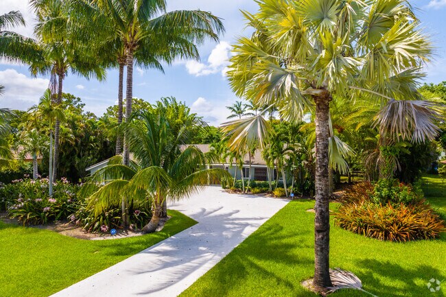 Many single family homes in The Hamlet neighborhood offer manicured lawns and lush landscaping.