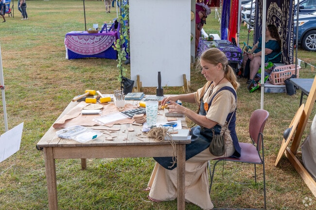 Artisans crafting leather goods were one of the booths at Midgard at the mill in Pickens.
