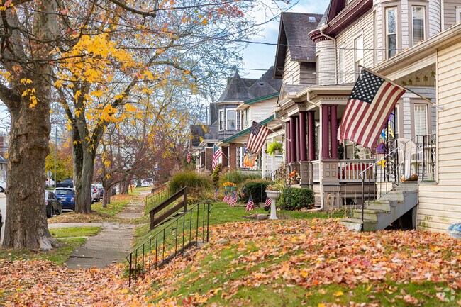 Early 20th century homes proudly display American flags outside their porches in Lawndale.