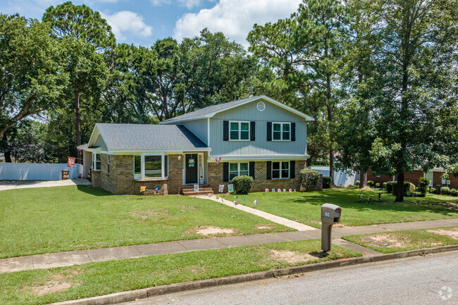 Some homes in Claremont are two-story with forestry in the backyard.