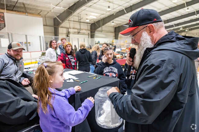 Picking the raffle prize winner is the honor of the youngest attendee at the Houston Hawks Gun and Outdoor Show in Big Lake.