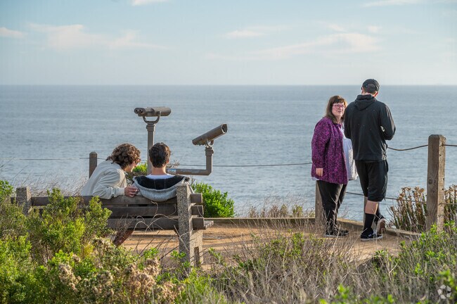 Crystal Cove State Park has benches and binoculars to view the wildlife and ocean.  The park features several miles of pristine beachfront along the Pacific Ocean, where visitors can enjoy sunbathing, swimming, surfing, and tidepooling.