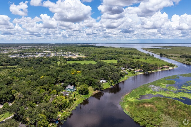 The serene St. John's River flows through Beck Hammock, offering water views.