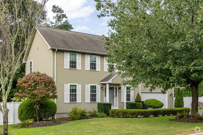 A modern colonial with mature trees in the Apponaug-Nausauket neighborhood is a pleasant home.