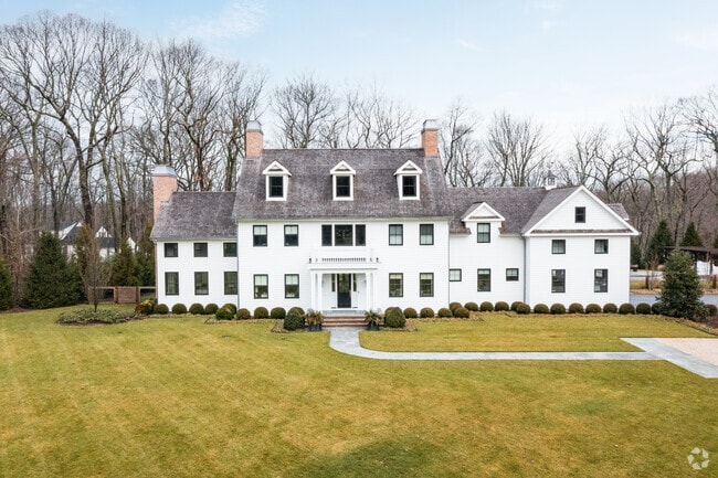A beautiful Colonial style home with beautiful land near the water of Cold Spring Harbor.