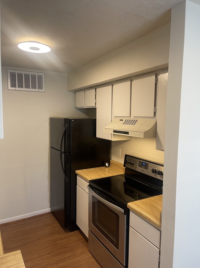 Upgraded appliances throughout kitchen. New microwave being installed to replace vent hood.