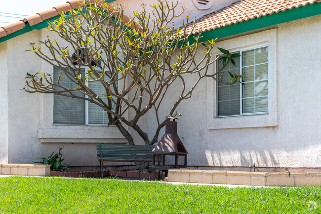 A charming nook awaits in front of a Spanish-style home in Crossroad.