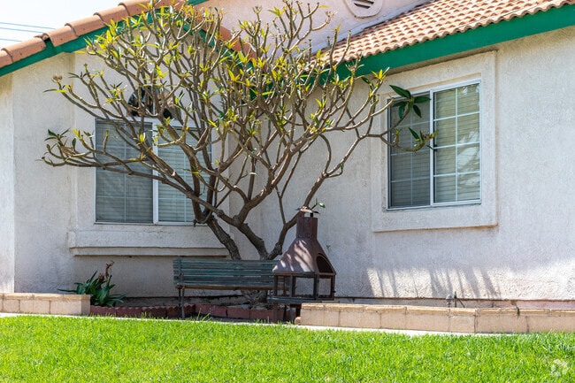 A charming nook awaits in front of a Spanish-style home in Crossroads.