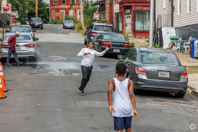 Mosher resident's hang out on the weekends washing cars and tossing the football.