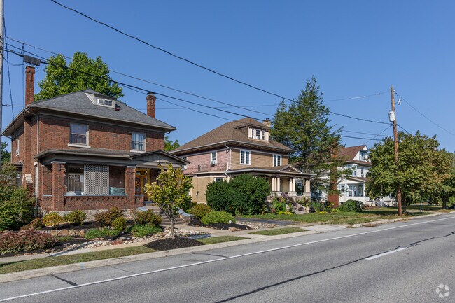 Front yards in Llyswen have a mix of mature and young maple and oak trees.