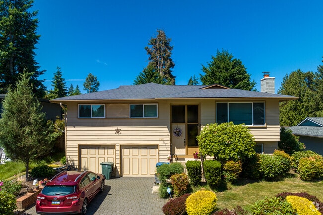 This Split Level Home Has Two Car Garage And A Lovely Front Yard.