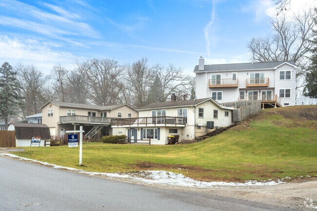 You can find two story homes with balconies and decks off the lake in White Oaks Bay.