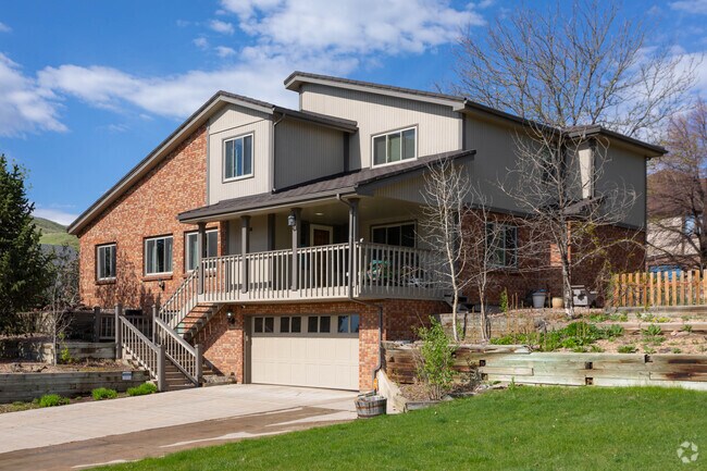 Large traditional houses with red brick and siding are a common sight in Mesa View Estates.