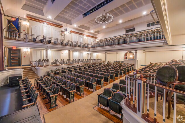 The grand interior combines historic charm with modern acoustics, making the Newberry Opera House a premier performing arts venue.
